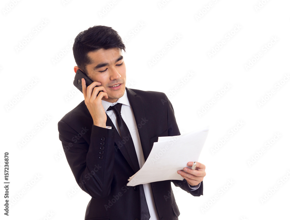 Young man in suit holding papers Young man in suit holding papers