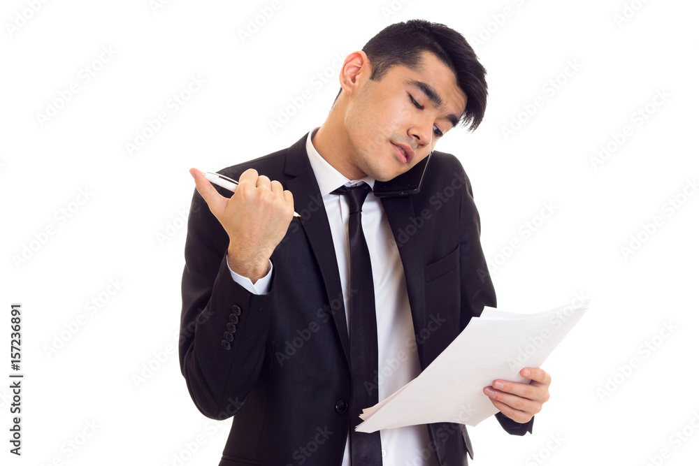 Young man in suit holding papers Young man in suit holding papers