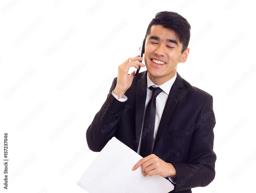 Young man in suit holding papers Young man in suit holding papers