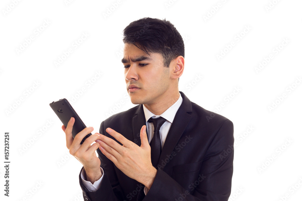 Young man in suit talking on the phone Young man in suit talking on the phone