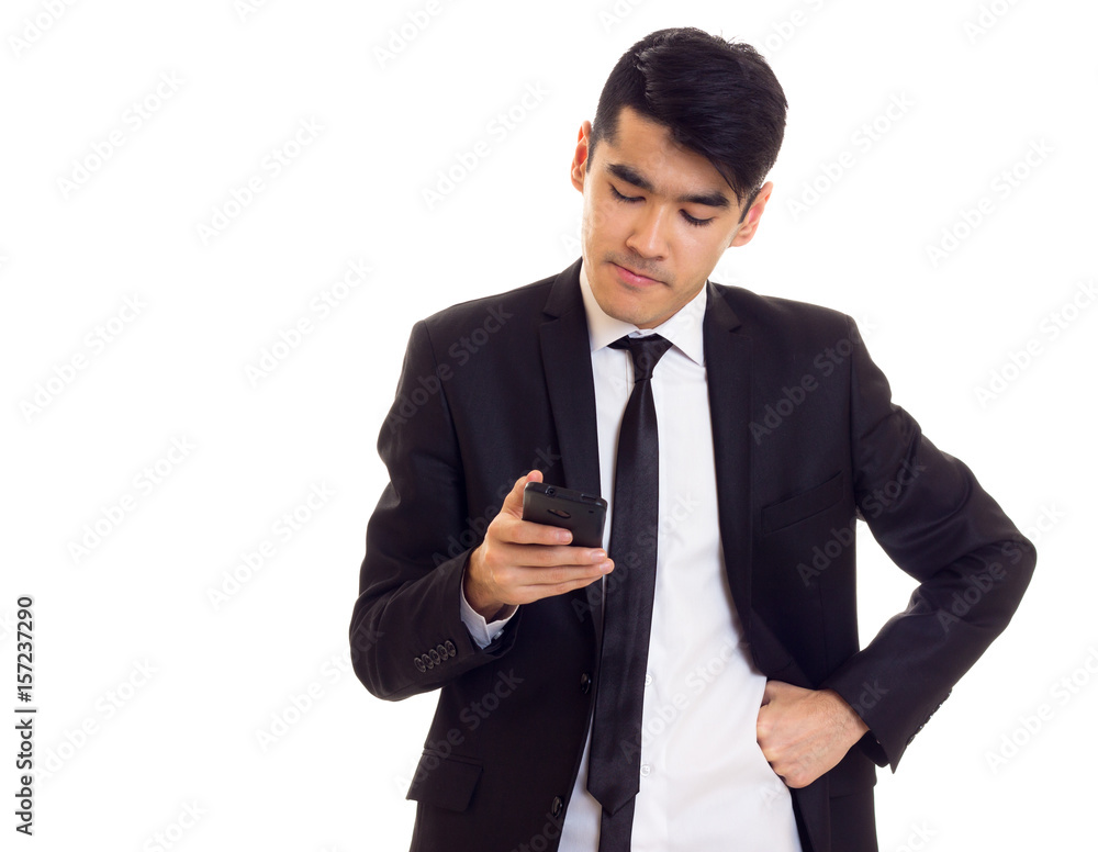 Young man in suit talking on the phone Young man in suit talking on the phone