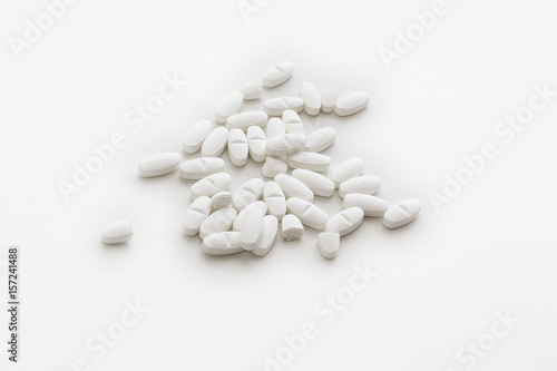 Group of whitel pills isolated on white