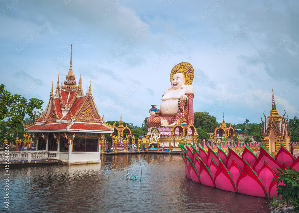 Naklejka premium Budai, the Chinesse Style Laughing Buddha, in Wat Plai Leam Temple on Koh Samui Island, Thailand