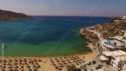 Aerial drone video of Mylopotas veach with turquoise waters, Ios island, Cyclades, Greece photo