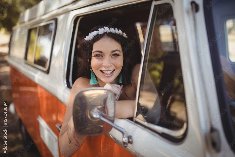 Portrait of cheerful woman sitting in motor home Portrait of cheerful woman sitting in motor home