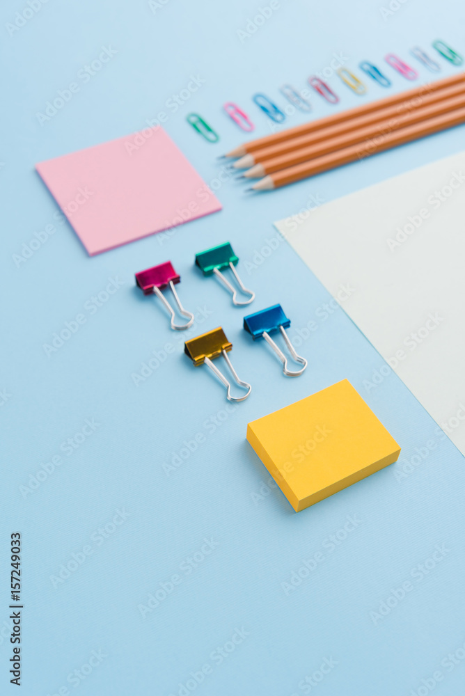 Office supplies on the blue background table Office supplies on the blue background table