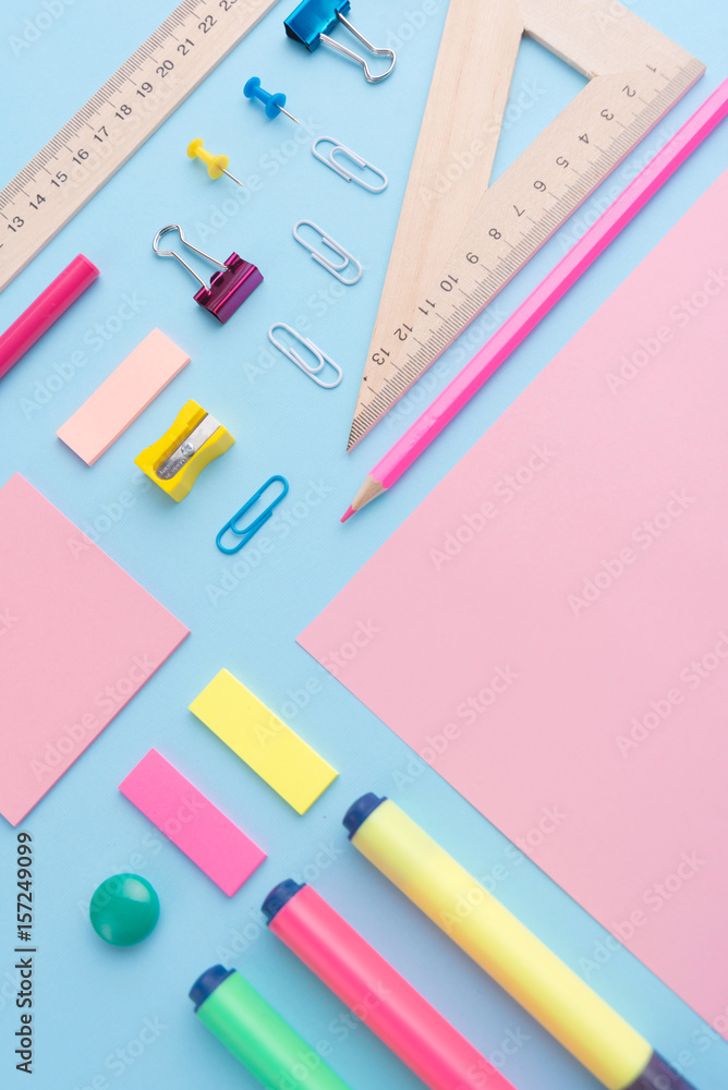 Office supplies on the blue background table Office supplies on the blue background table
