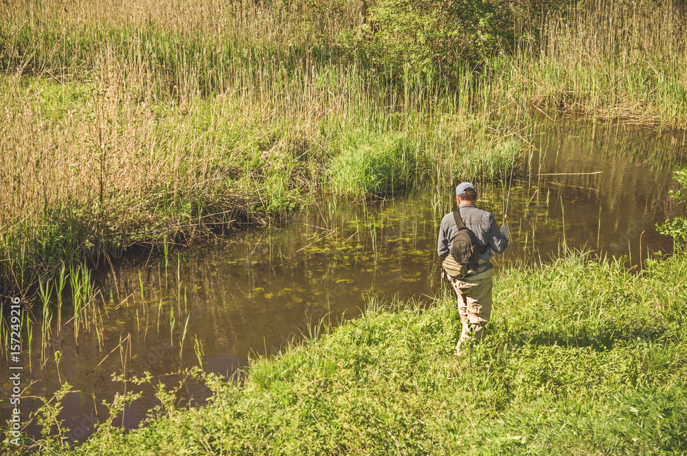 Fishing with tenkara on a small creek. Flyfishing. Fishing with tenkara on a small creek. Flyfishing.
