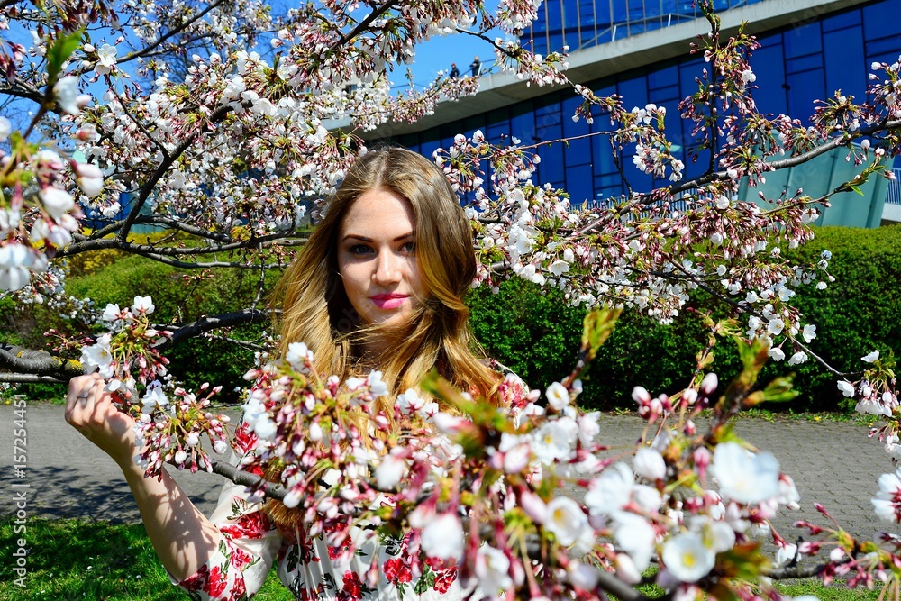 Young girl in Vilnius with cherry blossoms