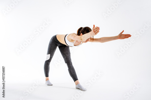 Sporty girl engaged in gymnastics