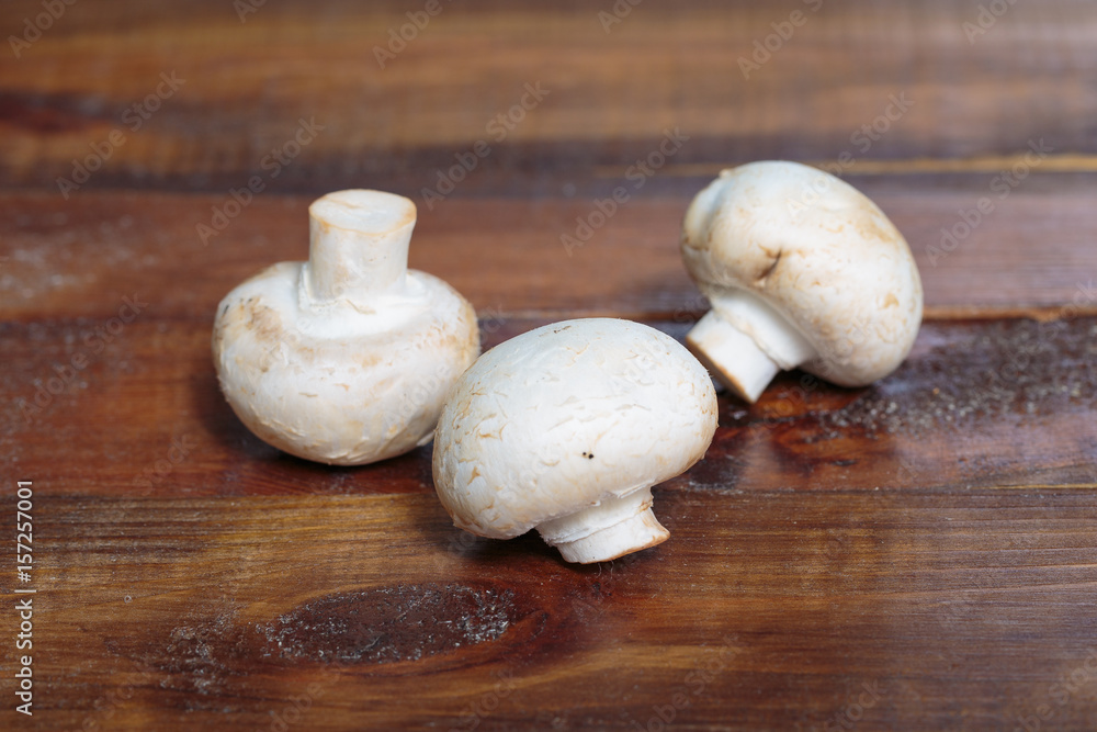 Three champignon mushrooms Three champignon mushrooms