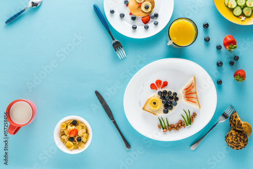 flat lay with creatively styled children's breakfast on plates