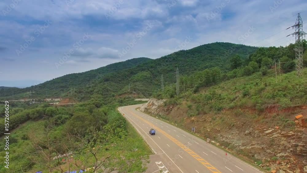 Aerial view Car on a winding road in the mountains of northern Thailand. Aerial view Car on a winding road in the mountains of northern Thailand.