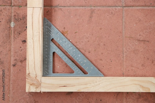 Measuring angle of wooden structure for making furniture