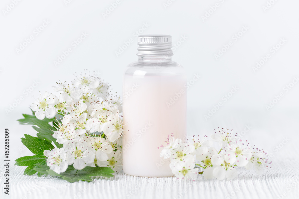 organic body lotion and fresh flowers