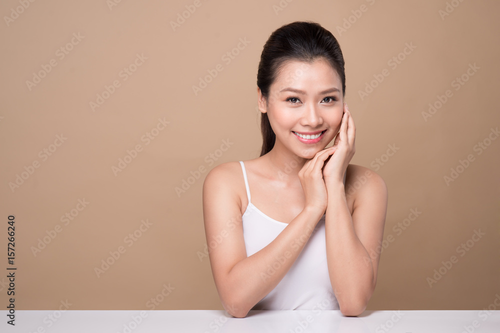 Beauty face. Facial treatment. Young asian woman with clean perfect skin touch her face. Beauty face. Facial treatment. Young asian woman with clean perfect skin touch her face.