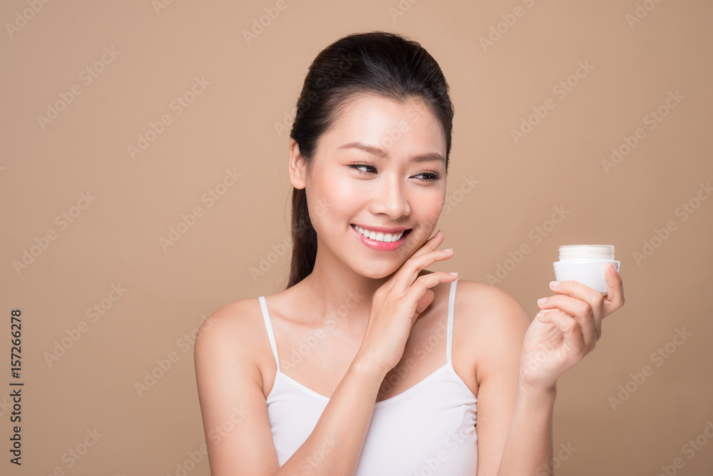 Skincare. Beautiful asian woman show moisturizer or lotion product. Skincare. Beautiful asian woman show moisturizer or lotion product.