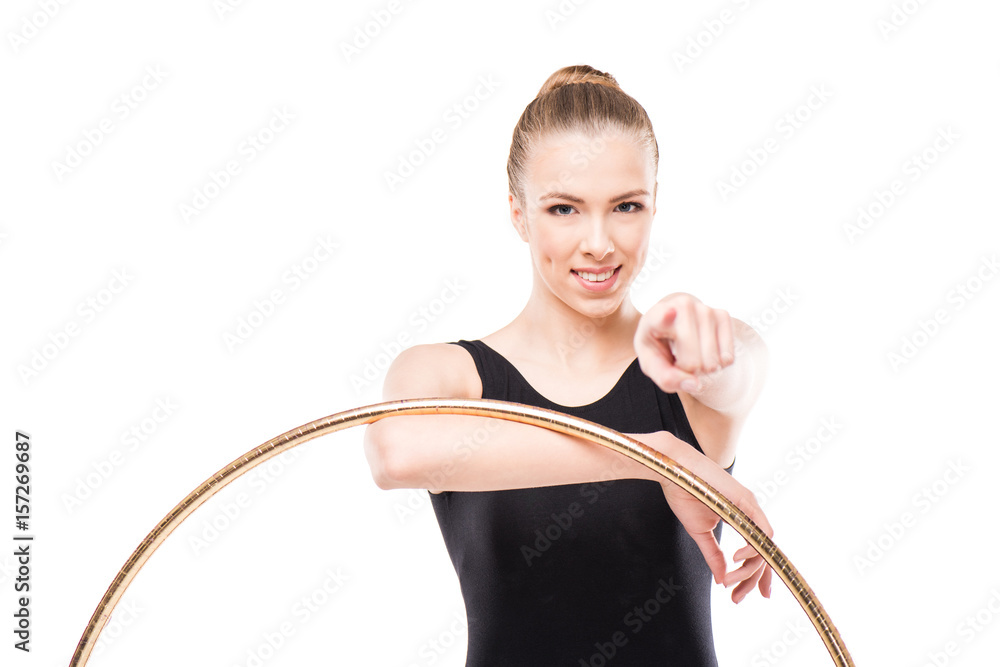 attractive rhythmic gymnast in leotard pointing with hoop isolated on white attractive rhythmic gymnast in leotard pointing with hoop isolated on white