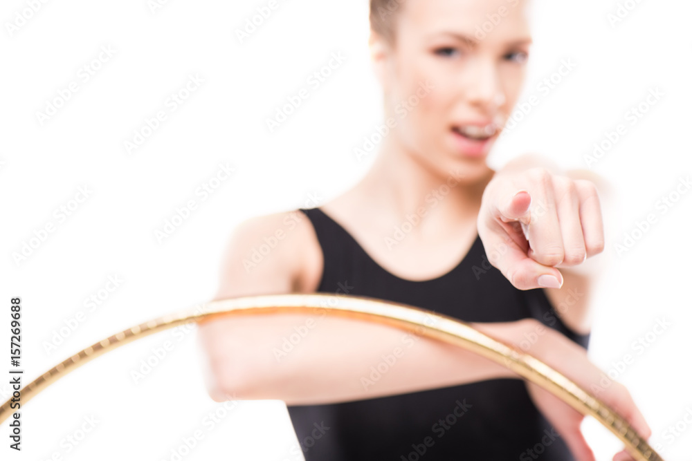 rhythmic gymnast in bodysuit pointing with hoop isolated on white rhythmic gymnast in bodysuit pointing with hoop isolated on white