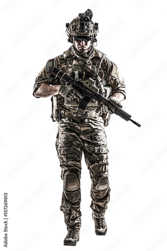 US Army rangers in combat uniforms with his shirt sleeves rolled up, in helmet, eyewear and night vision goggles moving walking towards camera. Studio shot, white background, dark contrast US Army rangers in combat uniforms with his shirt sleeves rolled up, in helmet, eyewear and night vision goggles moving walking towards camera. Studio shot, white background, dark contrast