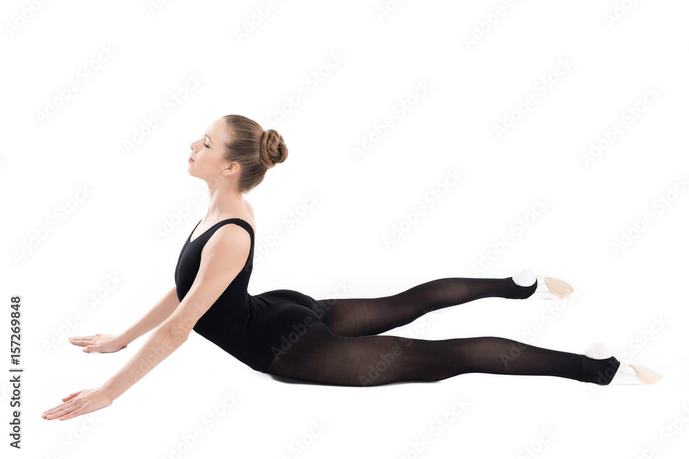 Athletic young woman in sportswear stretching isolated on white Athletic young woman in sportswear stretching isolated on white