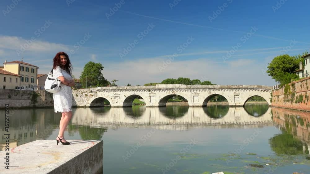 mature woman near ancient bridge in Europe mature woman near ancient bridge in Europe