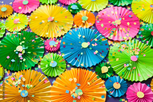 Colorful bright paper rosette. Decorating for a party.