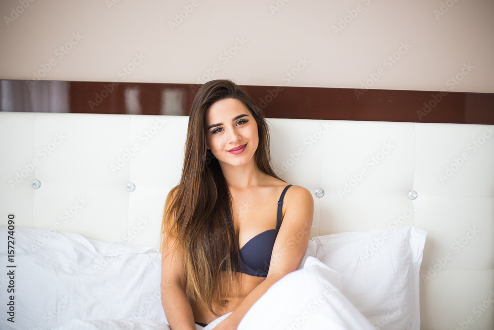 Woman lying in her bed after wake up in the morning at home Woman lying in her bed after wake up in the morning at home