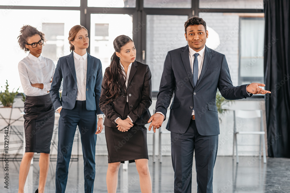 young businesspeople in formalwear posing while standing at modern office, multicultural business team young businesspeople in formalwear posing while standing at modern office, multicultural business team