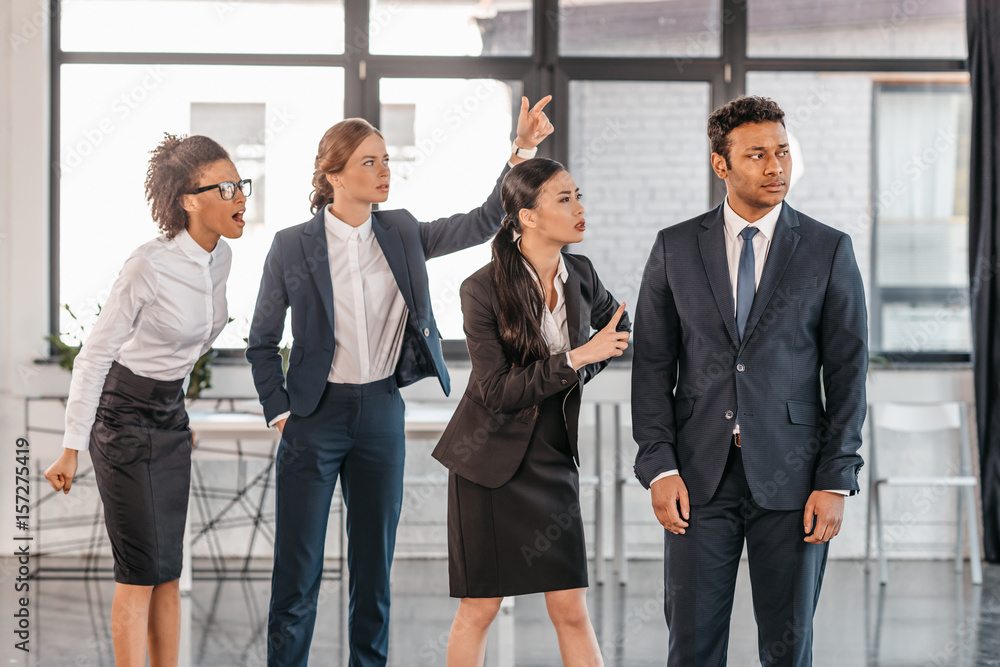 young emotional businesspeople in formalwear quarrelling at modern office, multicultural business team young emotional businesspeople in formalwear quarrelling at modern office, multicultural business team