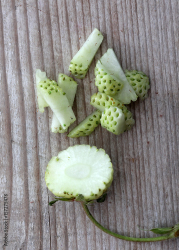 Strawberry fruit,unripe green, studio shot photo