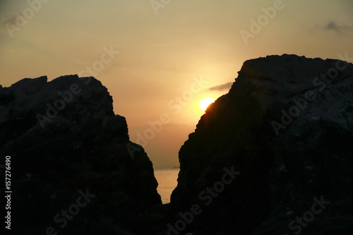 Stock Photo - Beautiful sunset between the mountains and the sea