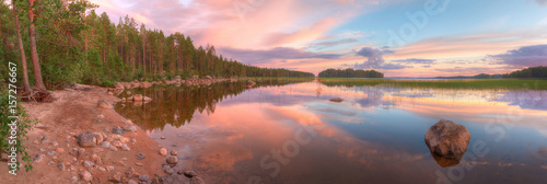 Panoramic evening landscape on the lake with beautiful sky. © dr_verner