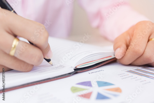 Photos People writing on notebook on wooden table