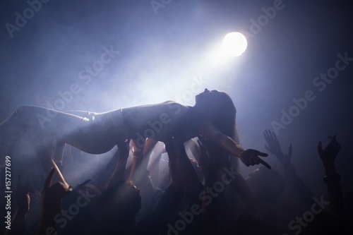 Crowd surfing at a concert