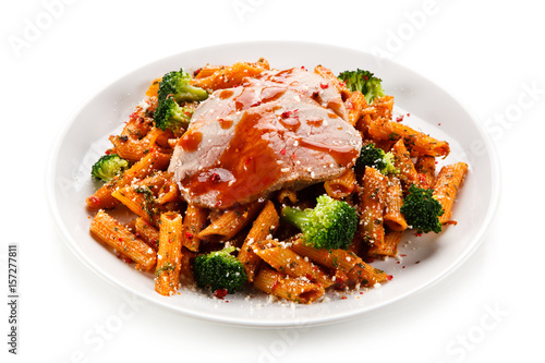 Pasta with meat, broccoli and tomato sauce on white background