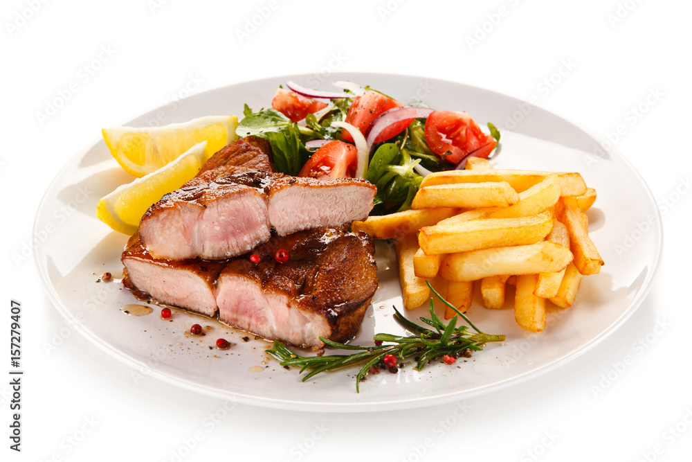 Roast steak with french fries on white background