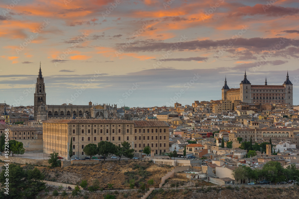 Toledo Alcazar and cathedral townscape at sunset