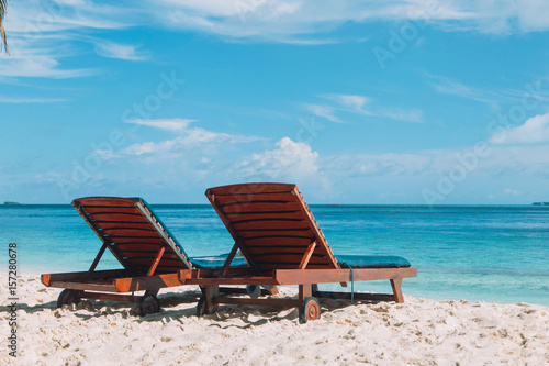 Two chairs on tropical beach