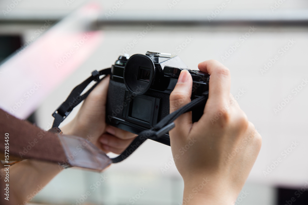 Camera in woman hand Camera in woman hand