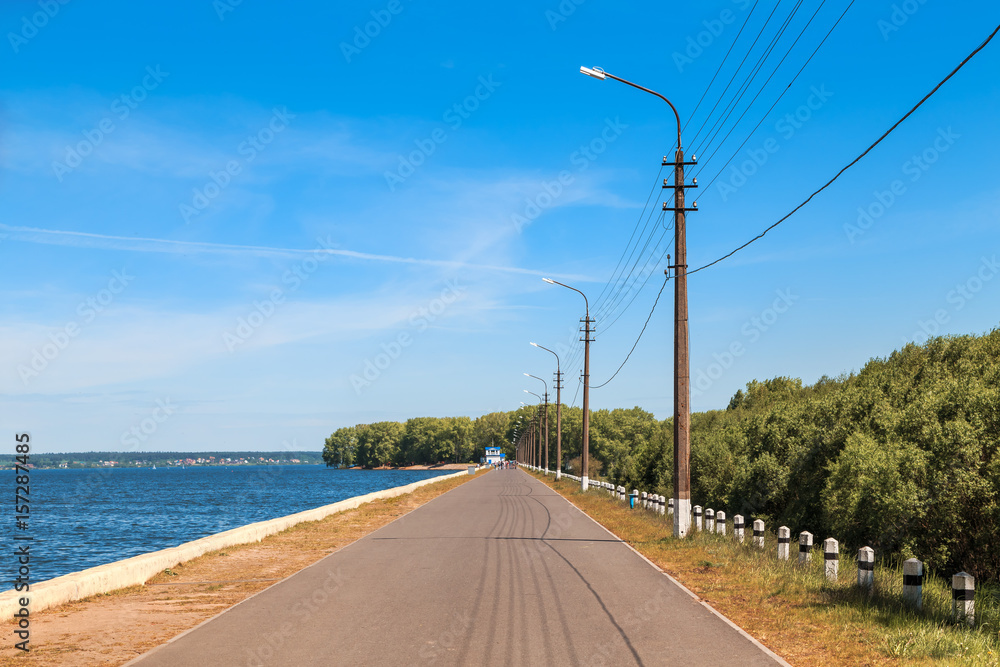 promenade with an asphalt path on the background of a beautiful summer landscape.