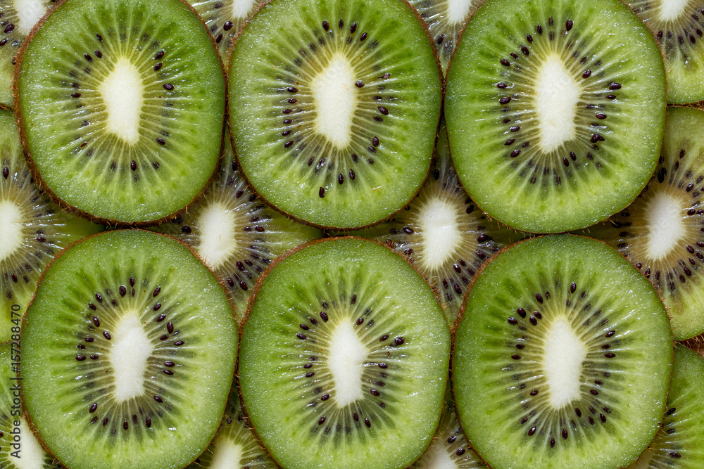 Sliced pieces of kiwi background texture Sliced pieces of kiwi background texture