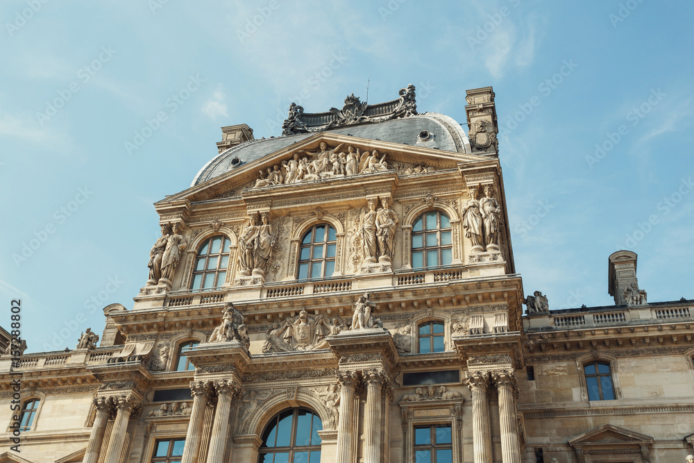 Look from below at beautiful building of The Louvre museum