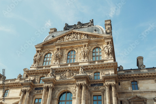 Look from below at beautiful building of The Louvre museum