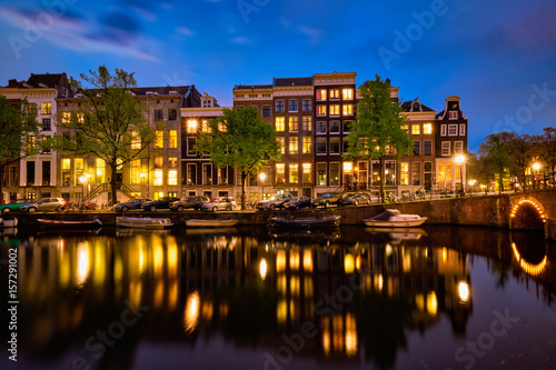 Amterdam canal  bridge and medieval houses in the evening
