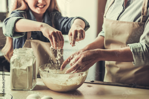 Grandma and granddaughter in kitchen
