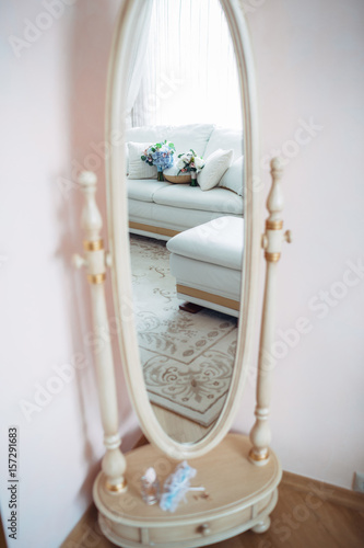 The luxury mirror stands in the room