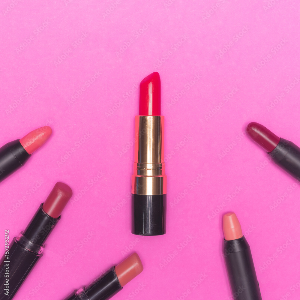 Lipsticks on pink background. Makeup and Beauty concept Lipsticks on pink background. Makeup and Beauty concept