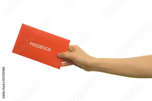 human hand hold passbook on isolated white background. photo