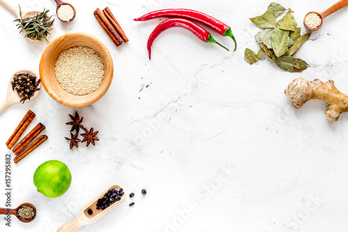 Cooking with spices, salt and pepper on kitchen table background top view mock-up